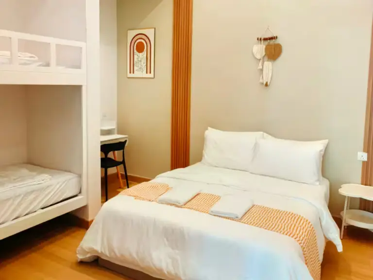 Bedroom 2: Queen-size bed and two single beds